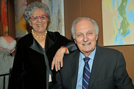 Alan Alda in shirt and tie and jacket with his wife Arlene with her arm resting on his shoulder in a smart black jacket and a string of pearls round her neck - in 2015.
