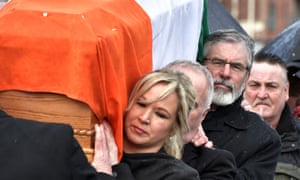 Gerry Adams and Michelle O'Neill, carry Martin McGuinness's coffin through the streets of Derry.