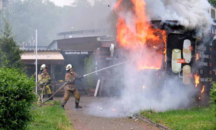 Firefighters put out a blaze at a coffee kiosk which ignited as a result of shelling in Kharkiv on Thursday.