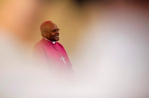 2011: Tutu is seen through crowds during a visit to a youth centre in Masiphumelele township near Cape Town