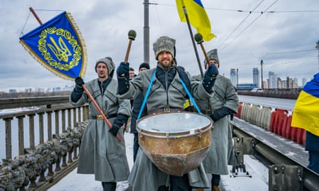 Marchers in traditional costumes mark Ukraine’s ‘day of unity’ in Kyiv on Saturday