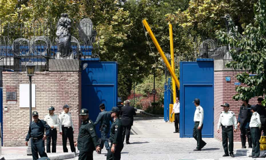 Iranian police stand guard outside the British embassy in Tehran after it opened in August 2015.