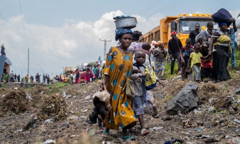 People make their way towards Goma as they flee a resumption of fighting in February. qhiukiqrihuinv
