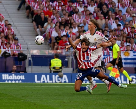Dean Huijsen fouls Giuliano Simeone during the Madrid derby