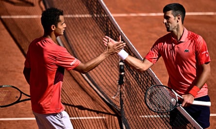 Serbia’s Novak Djokovic (right) shakes hands with Peru’s Juan Pablo Varillas after his victory at Roland Garros.