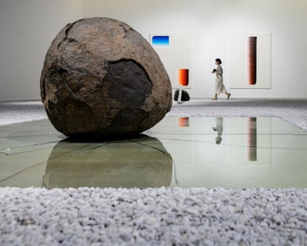 ‘More about violence’ … the artwork Relatum - an immensely large boulder on a gallery floor in what appears to look like a pool of water by Lee Ufan.