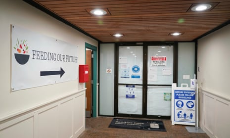 sign reading feeding our future in an office corridor