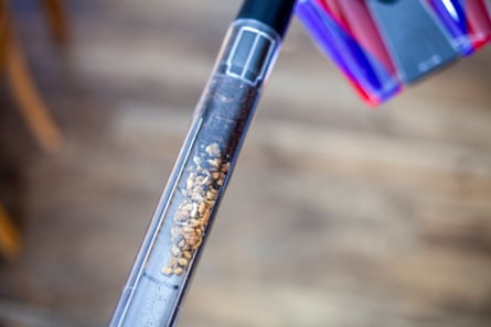 A Dyson PencilVac Fluffycones with a full bin