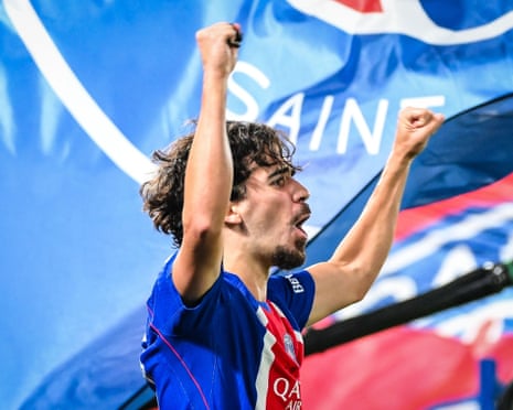 Vitinha of PSG raises both fists, shouting in celebration after scoring a goal