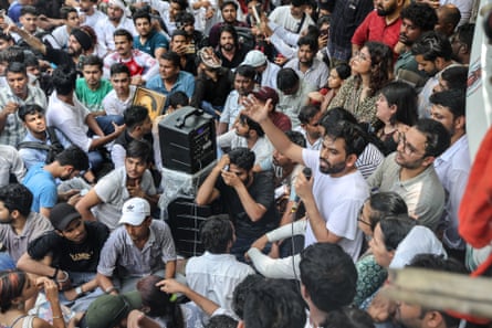 Abhijeet Dipke speaks surrounded by supporters