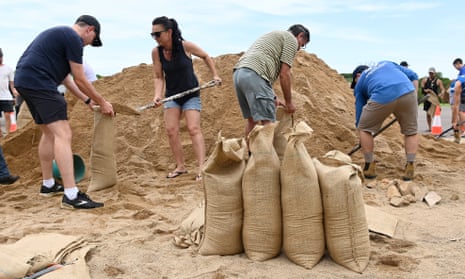 Townsville residents fill sandbags in preparation for Tropical Cyclone Kirrily yesterday.
