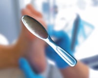 a short video clip showing various foot scrubbing tools and nail tools in front of a blurred images of a foot
