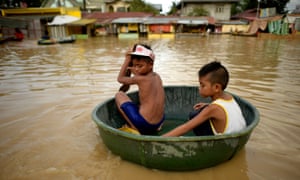 Children commute in a water basin