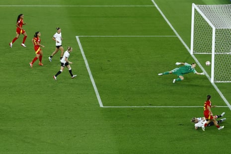 Spain's Aitana Bonmati (R), scores against Germany goalkeeper Ann-Katrin Berger