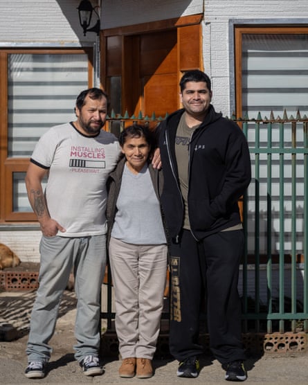 Peter with his biological mother, Mariza, and older brother, Jorge, outside the family home in Punta Arenas, Chile