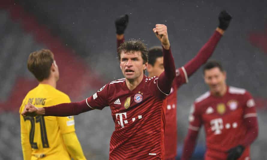 Thomas Müller celebrates giving Bayern the lead with a looping header.