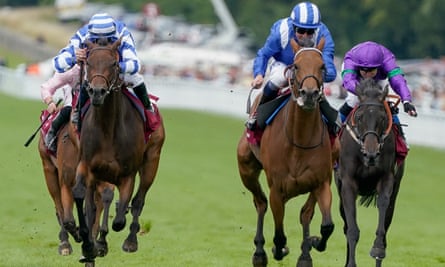 Al Husn (blue/white colours ) is victorious in the Nassau Stakes at Goodwood.