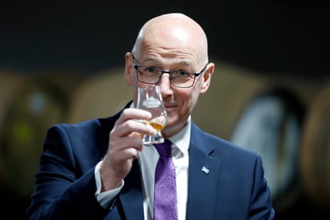 First minister of Scotland John Swinney samples whisky during a visit to Deanston Distillery in Doune, Scotland, on 1 May.