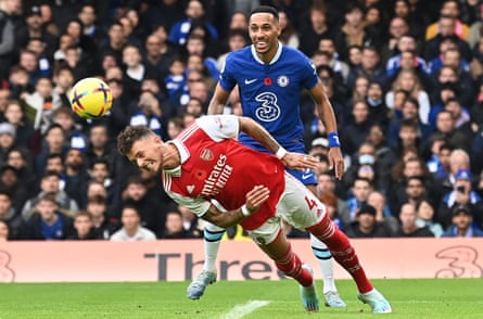 White clears the ball against Chelsea.