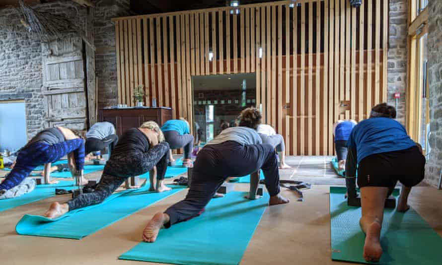 The days begin and end with yoga in Llwyn Celyn's huge stone barn.