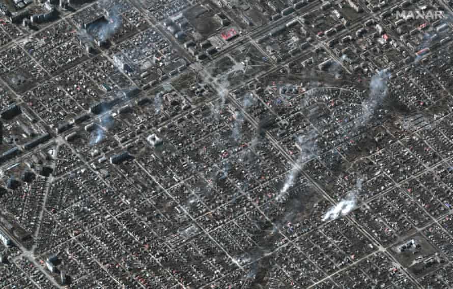 This satellite image taken and released on March 22 shows an overview of burning buildings in the Livoberezhnyi district of Mariupol, Ukraine