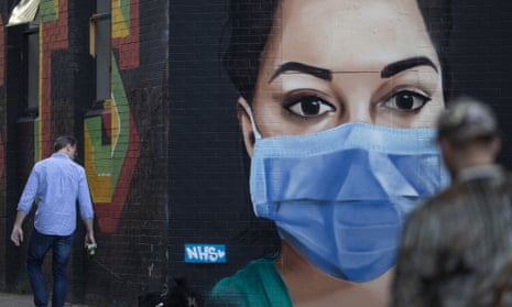 Street art depicting an NHS nurse wearing a face mask in London.
