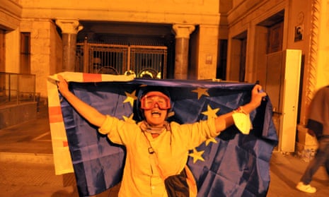 Demonstrator with a European flag protests against reintroduced ‘foreign agent’ bill on 1 May.