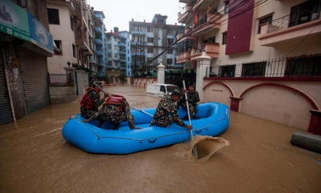 Nepalese army personnel rescue local people after a heavy rainfall in Kathmandu, Nepal