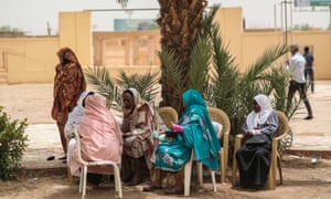Women take part in a sit-in by Sudanese opposition parties in Khartoum.