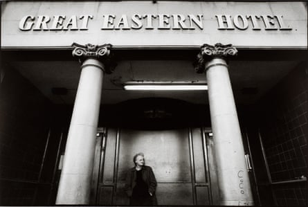 Man Standing in Entrance to Great Eastern Hotel by Jane Evelyn Atwood.