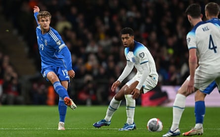 Giorgio Scalvini passes the ball past Jude Bellingham during a Euro 2024 qualifier between Italy and England at Wembley