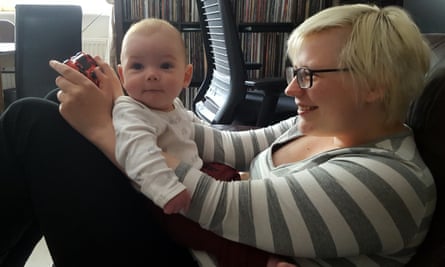 Keza playing video games when her son was a baby.