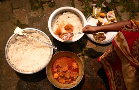 Woman cooking biryani, West Bengal, India