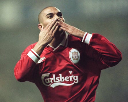 Stan Collymore salutes the Anfield crowd after scoring against Nottingham Forest in 1996.