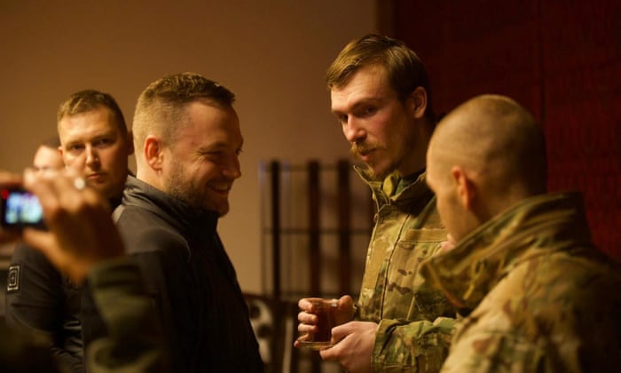 Ukrainian fighters Denys Prokopenko (C-R) speaking with Denys Monastyrskyi (C-L), Minister of Internal Affairs of Ukraine.