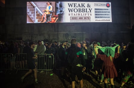 Jeremy Corbyn Makes A Guest Appearance At Glastonbury FestivalGLASTONBURY, ENGLAND - JUNE 24: Revellers queue underneath a politcal sign about Theresa May to enter a club in Block 9 in the Shangri La area at Glastonbury Festival Site on June 24, 2017 in Glastonbury, England. Labour Party leader Jeremy Corbyn will be addressing crowds at Glastonbury at both the Pyramid Stage and Left Field Stage. During the 2017 General Election Mr Corbyn surprised many as he made significant gains with his party, partially due to galvanising young voters when 61.5% of under 40’s voted Labour. (Photo by Chris J Ratcliffe/Getty Images)