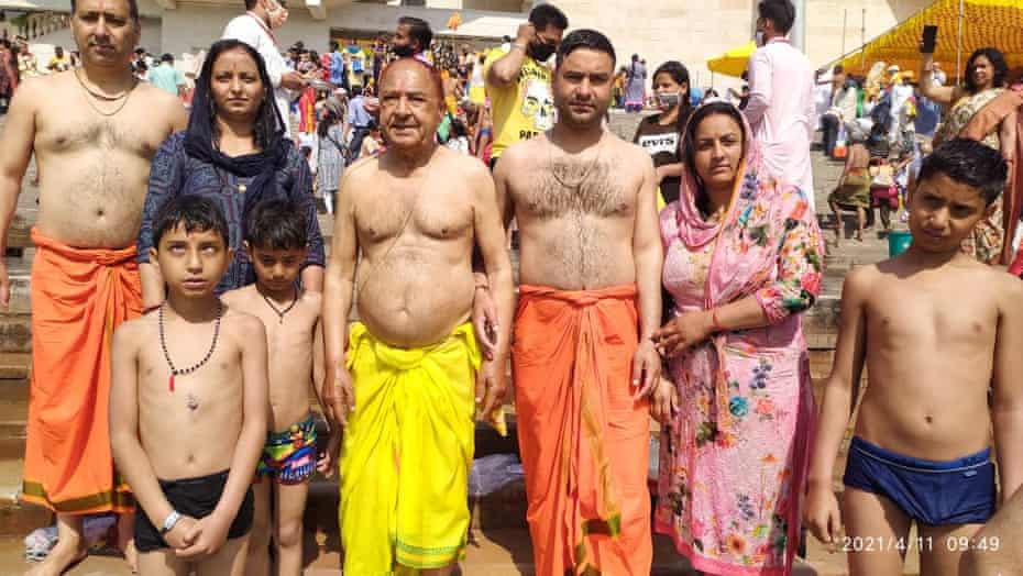 Thakur Puran Singh, in Yellow, standing on the bank of Ganges with his family during Kumbh