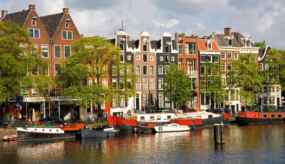 Row of houses along the Amstel River in Amsterdam