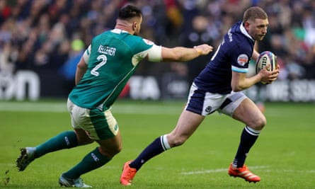 Scotland’s Finn Russell evades a challenge from Ireland’s Rónan Kelleher