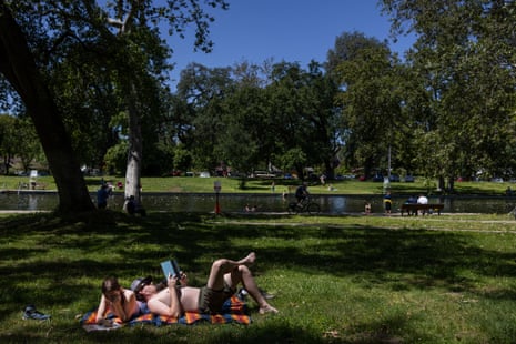 people relax on grass