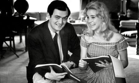 Smiling Kubrick and Lyon sit next to each other holding scripts