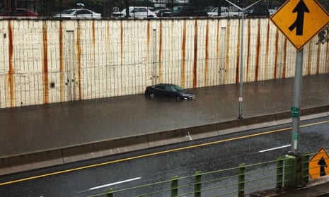 A vehicle sits submerged after it got stuck in high water on the Prospect Expressway during heavy rain and flooding on September 29, 2023 in the Brooklyn Borough of New York City.