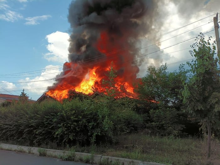 A residential house burns after a Russian military strike in the town of Bakhmut.