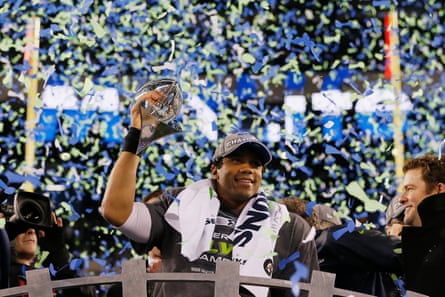 Russell Wilson lifts the Lombardi trophy after leading the Seahawks to their first Super Bowl title in February 2014.