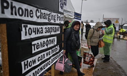 Ukrainian refugees and volunteers at Medyka border crossing, Poland, March 2022.