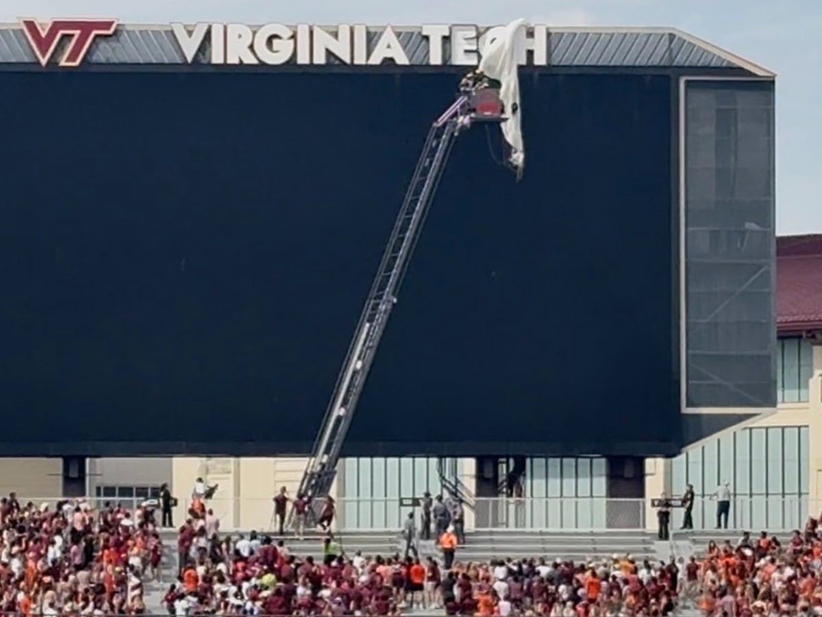 Skydiver rescued after crashing into scoreboard before Virginia Tech spring game | College football | The Guardian