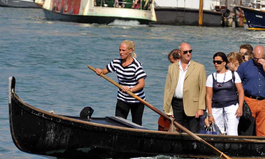Giorgia Boscolo brings passengers to the other side of the Canal Grande in a traghetto gondola in Venice.