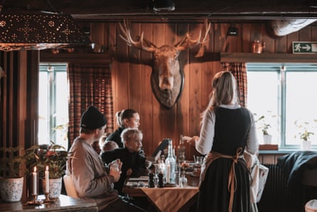 A meal being served to a family in a Swedish mountain restaurant