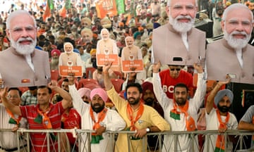 Supporters of the ruling Bharatiya Janta Party (BJP) holding cut-outs of India's prime minister Narendra Modi ahead of the seventh and final phase of voting in India's general election.