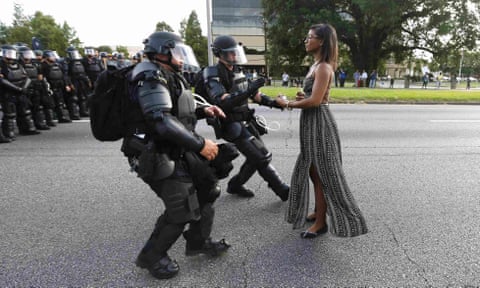 A demonstrator protesting the shooting death of Alton Sterling is detained by law enforcement in Baton Rouge in 2016.
